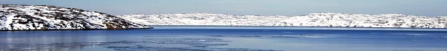 Foto: Bltt vatten med is och snlandskap